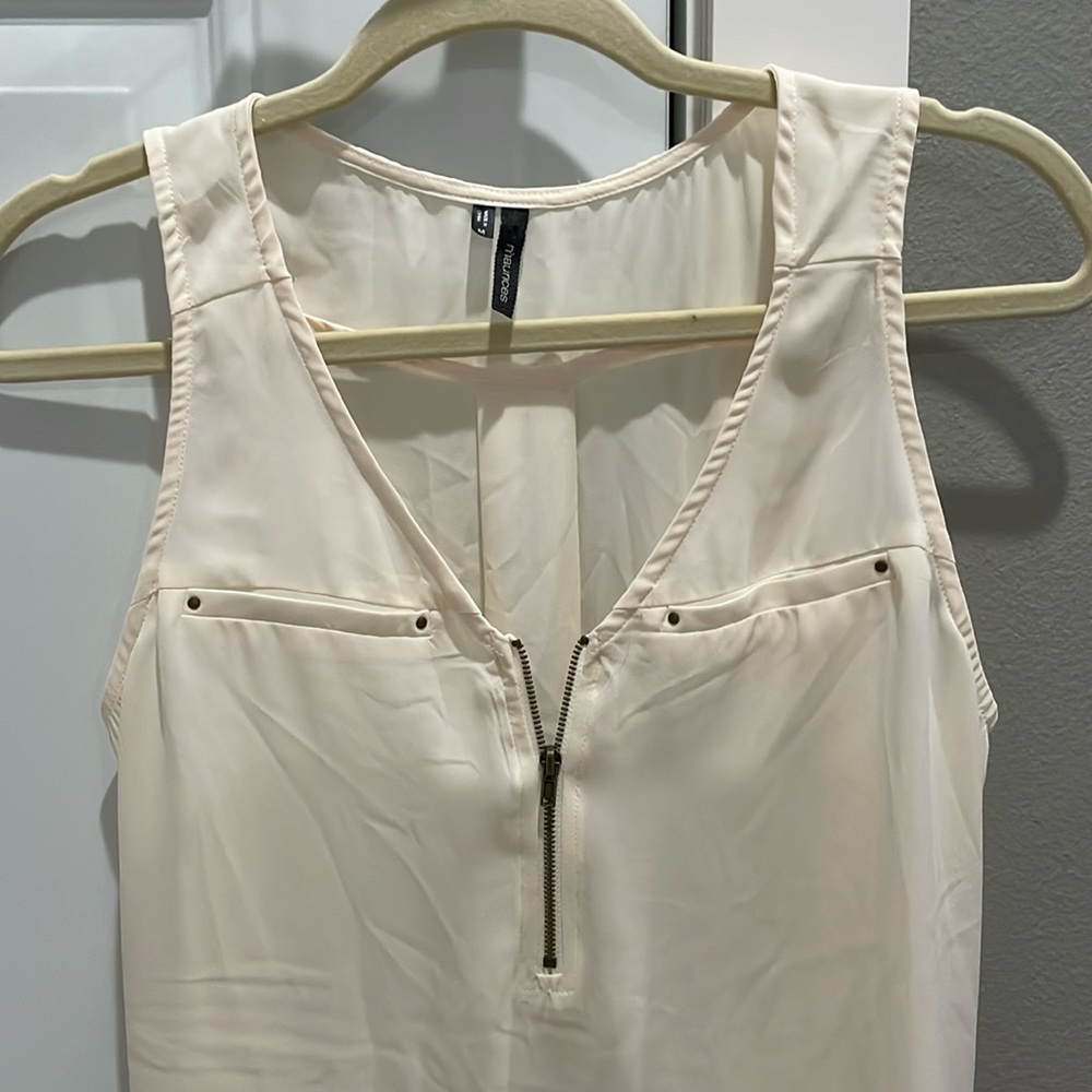 Sleeveless, sheer quarter-zip blouse in cream